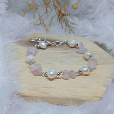 🌟 Radiate Love and Tranquility with Our Handcrafted Rose Quartz and Freshwater Pearl Bracelet! Lovingly handcrafted, this bracelet embodies the essence of natural beauty and heartfelt serenity. Each bead is meticulously selected from Rose Quartz stone and paired with luminous freshwater pearls, chosen for their soothing and harmonious properties. Set against a backdrop of copper silver-colored material, this bracelet combines earthy allure with modern sophistication. Its adjustable size comfort Handmade White Rose Quartz Bracelet, Handmade Dainty Rose Quartz Beaded Bracelets, Handmade Spiritual Pearl Bracelet As Gift, Handmade White Rose Quartz Crystal Bracelet, Silver Beaded Rose Quartz Bracelets, Hand-strung Rose Quartz Bracelet, Handmade Rose Quartz Silver Bracelets, Handmade Silver Rose Quartz Bracelets, Handmade Rose Quartz Crystal Bracelet With Round Beads