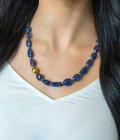 Custom designed for Skeie's Jewelers by Lika Behar, this gorgeous statement piece showcases 288.55ctw of tanzanite gemstones along with 24k yellow gold accents. 18" - 20" long. Details 24k yellow gold 288.55ctw of tanzanite gemstones 18" - 20" Elegant Tanzanite Jewelry With Faceted Beads, Gold Tanzanite Jewelry With Faceted Design, Gold Gemstone Beaded Necklace For Formal Occasions, Formal Gold Gemstone Beaded Necklace, Elegant Tanzanite Gemstone Bead Necklaces, Tanzanite Faceted Beads Jewelry For Gift, Elegant Tanzanite Gemstone Bead Necklace, Elegant Tanzanite Jewelry With Gemstone Beads, Elegant Tanzanite Beaded Necklace