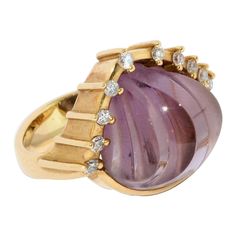 Enchanting 18 karat gold ring set with large amethyst and diamonds. By famous jewelry designer Cadeaux. 18 karat yellow gold, hallmarked Large, elegantly cut amethyst (shell-shaped) Set with 10 small diamonds Including certificate of authenticity. We adapt the ring size to your request. We also offer the matching bangle. The bangle is not included in the offer. You can find this under our other offers. Yellow Gold Amethyst Ring In Art Deco Style, Art Deco Yellow Gold Amethyst Ring, Yellow Gold Amethyst Ring With Diamond Accents, Art Deco Amethyst Ring In Yellow Gold, Formal Gold Amethyst Ring With Diamond Accents, Amethyst Ring In Yellow Gold With Diamond Accents, Modern Yellow Gold Amethyst Wedding Ring, Modern Yellow Gold Amethyst Ring For Wedding, Art Deco Yellow Gold Amethyst Ring For Formal Occasions