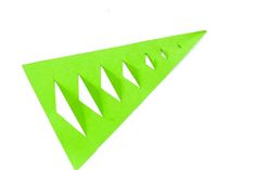 an origami green triangle on a white background