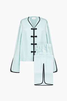 Mandarin-inspired mint-color pajama shirt and pants set in soft, lightweight certified viscose with a subtle shine. The boxy shirt features shawl lapels, handcrafted Chinese frog fasteners at the front, and flared split sleeves with contrast trimming. Its elasticated high-waist pants are slightly cropped with a gentle flare and front split that matches the sleeve. Designed for special occasions, you can wear it from bed to breakfast and beyond. Women Silk Pajamas, Womens Pajama Set, Pajamas Packaging, Sleepy Clothes, Pretty Pajamas, Pajamas Design, Flare Sleeve Shirt, Green Pajamas, Designer Pajamas