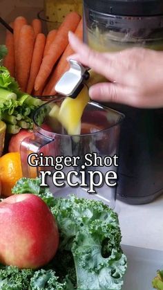 a person is using a blender to make a smoothie with fruit and vegetables