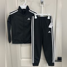 Brand New Never Worn Has Tags Black And White Unisex Track Suit Black Cotton Playwear Sets, Adidas White Long Sleeve Set, Casual Black Playwear Sets, Adidas Black Long Sleeve Set, Fitted White Adidas Sets, Adidas Black Fitted Sets, Fitted Black Adidas Sets, Adidas Black Sports Sets, Sporty Black Sets For Spring