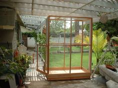 the inside of a greenhouse with lots of plants