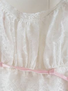 This is a vintage, Eyeful by Ruth Flaum, white, long nightie in a size 32 with pink trim. There is a discoloration and a mark on the garment. The interior label has a little cut in it. You can see this in the images. The price reflects this. All sales are final. This garment has the original tag. The sash has a metal ring at the end. The measurements are as follows: All measurements taken flat. Underbust 14 inches Don't forget to stop in at my other Etsy shop... http://www.etsy.com/shop/xtdesign White Lace Long Sleeve Nightgown, White Lace Trim Nightgown For Spring, White Lace Trim Nightgown For Party, White Lace Spring Nightgown, White Lace Trim Party Nightgown, Women's Nightgowns, Pink Trim, Nightgowns, Metal Ring