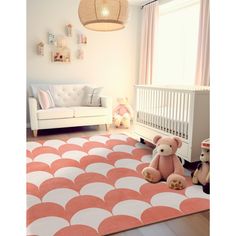 a baby's room with pink and white decor