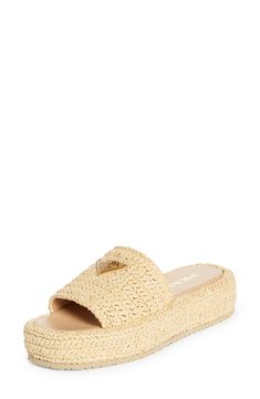 Give your warm-weather style a playful boost with this easy slide sandal crocheted in faux raffia with a shiny finish and lifted by a chunky platform. 1 3/4" heel (44mm) 1 1/4" platform; 1/2" slope (size 9) Textile upper/leather lining/synthetic sole Made in Italy Designer Shoes Luxury Summer Wedge Sandals, Straw Open Toe Slides With Textured Footbed, Straw Slides With Textured Footbed And Open Toe, Luxury Slides With Textured Footbed For Spring, Luxury Straw Sandals With Woven Sole, Luxury Synthetic Sandals For The Beach, Luxury Synthetic Beach Sandals, Open Toe Slides With Woven Straw Sole, Luxury Straw Sandals For Summer