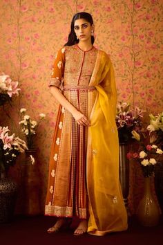 Amber mustard yellow pleated anarkali with scattered woven floral motifs and floral zardozi hand embroidery. Paired with a pant and coordinating belt. Comes along with a dupatta with scattered butti embroidery. - Aza Fashions Yellow Slub Silk Churidar For Festivals, Traditional Yellow Slub Silk Anarkali Set, Yellow Slub Silk Anarkali Set With Pallu, Yellow Silk Churidar With Gota Work, Yellow Cotton Silk Anarkali Set With Cutdana, Yellow Anarkali Chanderi Palazzo Set, Yellow Floor-length Kurta With Cutdana, Yellow Slub Silk Anarkali Set With Dupatta, Yellow Anarkali Set With Traditional Drape