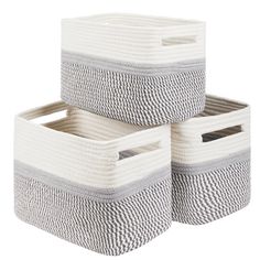 three woven storage baskets stacked on top of each other, one white and the other grey