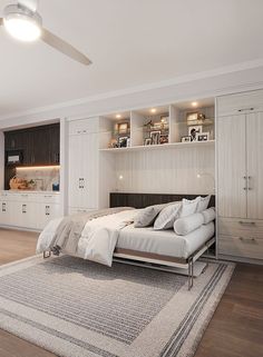 a bedroom with a bed, dressers and shelves in the wall next to it