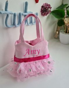 Refresh your accessory selection with our sassy tote bag. This cute cotton fabric tote features a snap enclosure and 1 main compartment to store all of your belongings. The Tote bagpurse measures approximately H13cm x W14cm. Its suitable for Children Ages 2 to 5years.It is made from 100% Cotton Canvas Fabric with 3 layers of soft Tulle and text is heat pressed using glitter vinyl. You can also drop me a message if you want this design in a different colour. Cute Fabric Bags For Gifts, Fun Pink Bags For Playtime, Pink Fabric School Bag, Playful Pink Bag For Birthday, Pink Fabric Bag As Gift, Fun Pink Party Bags, Pink Fabric Bag As A Gift, Fun Pink Cotton Bag, Pink Fabric Bag For Gift