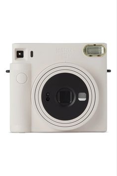 an image of a white camera on a white background with the lens facing up to the camera