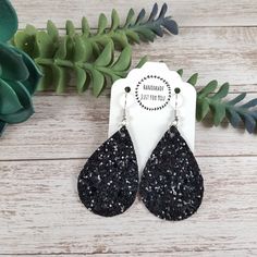 "These Christmas or New Years black glitter teardrop earrings are so sparkly!  They are covered in tiny sequins with a canvas like backing making them firm in shape.  One of my favorite features is that they are lightweight and noise free.  Which means you'll want to keep the rubber backs on while you wear them so you don't lose one! *Size = Small = 2\" long x 1.25\" wide with a drop length of 2.5\" *last photo shows other styles and sizes listed elsewhere in the store - these are the Small Teardrop* *Thickness = 0.8mm = thin* > Durable > Noise free > Affordable > Nickel free fishhook ear wire > Rubber backs included so you can wear them without losing one! I have a variety of colors and styles to choose from so be sure to view my other listings: https://bethwolfhandmade.etsy.com All items Black Glitter Jewelry For Party, Sparkling Black Earrings For Party, Glitter Teardrop Earrings As Gift, Glitter Teardrop Earrings For Gifts, Holiday Earrings, Wood Bead Garland, Earrings Christmas, Holiday Earring, New Year Holidays