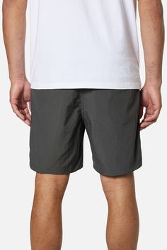 Inspired by one of our original 1970's short designs, the Trails Nylon Short is a favorite in our collection. Made from a lightweight nylon fabric, the Trails Short has a 17" outseam and features an elastic waistband, front patch pocket, back welt pockets, notched side seam hem, faux fly and interior binding. 100% Nylon Front patch pockets Back welt pockets Faux fly Notched side seam hem Interior binding 17" outseam | Trails Nylon Shorts Men's Size X-Large in Black Wash by Katin Nylon Shorts, Designer Shorts, Nylon Fabric, Welt Pockets, Welt Pocket, Patch Pocket, Mens Shorts, Rum, Binding