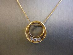 "FOR SALE IS THIS LOVELY WOMENS VINTAGE ESTATE .925 STERLING SILVER GOLD TONE NECKLACE WITH A GOLD TONE PENDANT THAT HAS 3 CZ STONES. THE NECKLACE MEASURES ABOUT 17 3/4\" LONG AND THE PENDANT MEASURES 3/4\" IN DIAMETER BY 3/16\" WIDE. TOGETHER THEY WEIGH 4.7g. BOTH ARE MARKED .925. ANY QUESTIONS PLEASE DO NOT HESITATE TO ASK. BE SURE TO CHECK OUT SOME OF MY OTHER GREAT ITEMS UP FOR SALE. THANK YOU." Cz Pendant, Sapphire Diamond Ring, Keepsake Jewelry, Gold Tone Necklace, Custom Necklace, Cz Stone, Silver Gold, Vintage Ladies