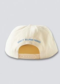 As seen on Hailey Bieber. Adjustable snapback baseball cap with Montauk embroidery at the front. Paneled fabrication finished with a flat brim. Circumference: Adjustable Unisex COLOR VARIATIONS: Ivory w/ Teal & Blue Embroidery Hot Pink w/ White Embroidery Red w/ Orange and White Embroidery Light Brown w/ Cream & Pink Embroidery Cream w/ Green & Gold Embroidery Black w/ White & Gold Embroidery Aqua Green w/ Hot Pink Embroidery Return Policy Shipping Policy Cream Casual Hat With Flat Bill, Casual Cream Flat Bill Hat, Cream Cotton Snapback Baseball Cap, Cream Cotton Snapback Hat, Cream Snapback Baseball Cap, Cream Embroidered Snapback Baseball Cap, Cotton Snapback Baseball Cap, Embroidered Logo Snapback Hat With Flat Bill, Snapback Hat With Embroidered Logo, One Size