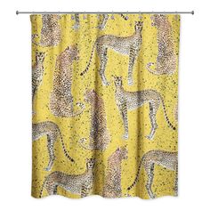 a shower curtain with cheetah and leopards on it, against a yellow background