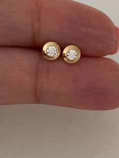 14K Gold Bezel Stud Earrings | Bezel Set Diamond Alike Earrings Studs | 14k Gold Earrings | Shiny Design Bezel Studs | 14K Gold Bezel Studs♦ Materials: 14K Gold, Cubic Zirconia♦ Available colors: Yellow Gold ♦ Closure: Screw Back♦ Earrings Measurements: The outer earrings is 5MM diameter. The Cubic Zirconia is 3MM widePLEASE REFER TO THE ACTUAL DIMENSIONS. WE HAVE ENLARGED THE PICTURES FOR A BETTER VIEW---------------------------------------------------------------------------------------------- Double Diamond Stud Earrings, Bezel Set Earrings, Double Diamond, Collection Ideas, Set Earrings, Bezel Set Diamond, Circle Studs, Earrings Studs, Diamond Stud Earrings