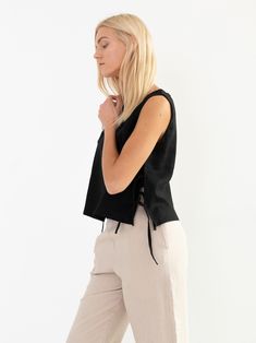 "AVERY is a linen tank top with side ties. DETAILS - Sleeveless design - Crew Neck - Side Ties - Straight cut - 100% lightweight European linen fabric - Cut and sewn to order just for you in our studio COLOR - Black, you can also choose other colors above - Fabric samples are available here https://www.etsy.com/listing/586569696/linen-fabric-samples SIZING & FIT - Fits true to size - Length is approximately 19 inches / 48 cm - Bust is approximately 19 inches / 48 cm - Measurements taken from Sleeveless Tops With Drawstring Tie, Chic Black Linen Tank Top, Black Linen Sleeveless Tank Top, Black Linen Casual Tank Top, Casual Linen Tops With Tie Straps, Casual Black Linen Tank Top, Black Linen Spring Vest, Black Sleeveless Linen Vest, Linen Sleeveless Top