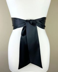 "Black Satin Sash  Solid Black Sash Belt  Wedding Dress Sash  Black Dress Sash  Cocktail Dress Belt  Bridesmaid Sash  Satin Swank  This Satin Swank® reversible waist sash is the perfect finishing touch for your bridesmaid, wedding, or special occasion dress, or just the right piece to add instant polish to your dress or top. Depending on your waist size and the length you choose, you can wrap the sash around your waist once or twice. You decide whether to tie the sash in a bow or a simple knot w Black Sashes Belt For Party, White Wedding Dress With Black Sash, Formal Gold Sashes With Belt Details, Wedding Belts And Sashes Black, Elegant Fitted Tie-waist Sash, Bridesmaid Sash, Waist Sash, Wedding Dress Sash, Wedding Dress Belt