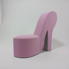 a pink chair that is shaped like a shoe