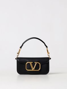 Find VALENTINO Mini Bag on Editorialist. Valentino Garavani mini bag with top handle and detachable chain strap. The bag features a gold tone logo and a flap open closure. It can be hand carried, worn on the shoulder or worn crossbody. Valentino Mini Bag, Classic Evening Shoulder Bag With Logo Hardware, Classic Evening Flap Bag With Logo Hardware, Elegant Crossbody Satchel With Logo Hardware, Chic Shoulder Flap Bag With Logo Hardware, Chic Top Handle Satchel With Logo Hardware, Chic Formal Flap Bag With Logo Hardware, Evening Flap Shoulder Bag With Logo Hardware, Chic Rectangular Flap Bag With Logo Hardware