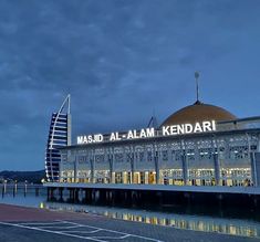 a large building with a sign that reads masad al - alam kendari