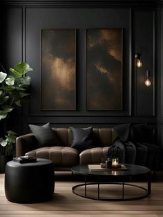 an elegant living room with black walls and leather furniture, large painting on the wall