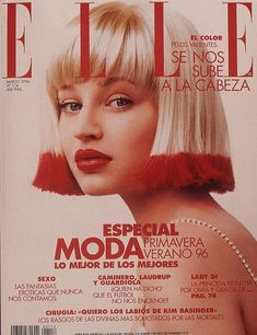 an image of a magazine cover with blonde hair and red lipstick on the front page