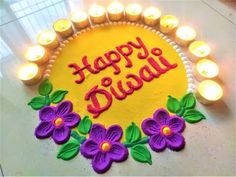 a birthday cake with candles around it that says happy diwal