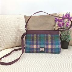 Our Harris Tweed Large Shoulder Bag is a brilliant size with a durable style, that can be used every day. The shoulder bag has one main compartment, secured with a zip. Inside this Harris Tweed bag there are open pockets for phones and essentials as well as a small zip compartment. This bag has a short shoulder strap as well as a longer detachable strap that you can wear across your body. Large Shoulder Bag Dimensions: 20cm x 30cm x 9cm The vegan leather trim colour will differ depending on the Rectangular Tweed Bag For Daily Use, Rectangular Tweed Bags For Daily Use, Tweed Bag With Detachable Strap, Rectangular Shape, Rectangular Tweed Bag With Detachable Strap, Rectangular Tweed Shoulder Bag For Travel, Rectangular Tweed Shoulder Bag For Everyday Use, Rectangular Tweed Shoulder Bag For Everyday, Everyday Tweed Crossbody Bag, Harris Tweed Bag