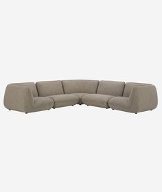 a large sectional couch with four seats and one arm extended to the side, on a white background