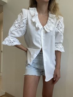 A lovely vibtagw white cotton blouse with a crochwt emroidery. Absolutely amazing quality and attention to detail! Size XS-M Our model is a size Xs -S and the top is not pinned on her. Mint condition, deadstock vintage item. Looks amazing in person! Cotton Lace Tops, White Cotton Blouse, Embroidery Top, Cotton Blouse, White Embroidery, Cotton Top, Cotton Blouses, Cotton Tops, Womens Clothing Tops