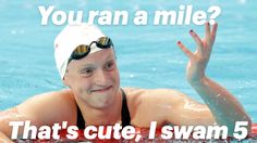 a man in a swimming cap and goggles is making the peace sign with his hand