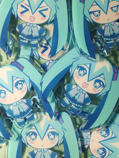 some blue and white stickers with anime characters on them in the shape of hearts