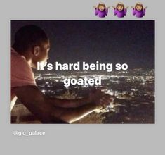 a man sitting on top of a tall building next to a city at night with the caption it's hard being so goated