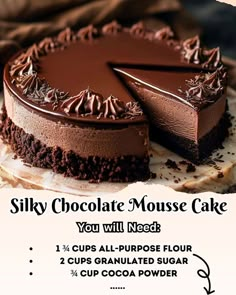 a chocolate cheesecake on a plate with the words silky chocolate mousse cake