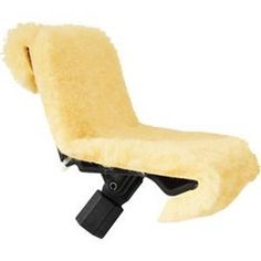 a yellow chair that is sitting up against a white wall and has a black foot rest on it