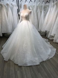 a white wedding dress on display in a store