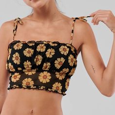 Super Pretty Black Mesh Bustier Bralette Top From Hollister/Gilly Hicks! Yellow Daisies Printed On The Material And Ties At The Shoulder. Sheer On The Bottom Half And Removable Pads. New With Tags, Never Worn Size L, True To Size (Fits D Cup And Above) Yellow Crop Top With Built-in Bra, Yellow Tank Top With Built-in Bra For Spring, Yellow Tank Top With Built-in Bra For Summer, Trendy Floral Print Sleeveless Tube Top, Summer Bandeau Tank Top With Straps, Yellow Sleeveless Tube Top For Summer, Yellow Summer Style Tube Top, Yellow Sleeveless Crop Top With Built-in Bra, Yellow Summer Top With Built-in Bra