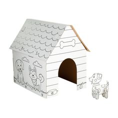 a cardboard dog house with two dogs on the front and one in the back that has been cut out