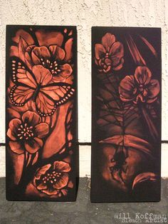 two metal panels with flowers and butterflies painted on them