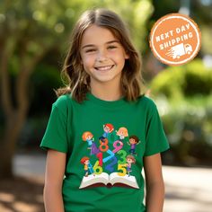 Celebrate the first day of school with the First Grade Shirt with Number Print. This stylish back-to-school shirt is perfect for marking the start of 1st grade, featuring a bold number print that proudly displays your child's new grade level. Whether it's for the First Day Of School or as a fun Preschool Shirt, this shirt is an ideal Back to School Gift that will make your little one feel special and excited about the year ahead. ✨ F E A T U R E S ✨ 👕 Tailored fit with vibrant colors that remai School Spirit Shirt For Students Back To School, Back To School Spirit Shirt For Students, Green Pre-shrunk Shirt For School, Green School Spirit Tops For School, Green Short Sleeve School Shirt, Green Graphic Print School Shirt, Green Short Sleeve T-shirt For School, Green Graphic Print Shirt For School, Green Short Sleeve Shirt For School