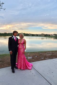 Pink Jovani Prom Dress, Pink Prom Inspo Couple, Lake Prom Pictures, Pink Prom Dresses Couple, Pink Prom Date Couple, Hot Pink Prom Dress With Date, Pink Prom Dresses With Date, Fitted Sleeveless Gown For Prom Season, Fitted Sleeveless Gown For Prom