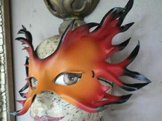 Hand sculpted from leather, then  painted to resemble fire.  Burnt orange blends of coloring to deep dark red and flowing through to charcoal black at the tips.  Adult sized and it's got adjustable elastic ties.  This mask measures approximately 12 inches wide by 8 tall. Fire Elemental, Bird Masks, Black Goth, Beautiful Mask, Charcoal Black, Adult Costumes, Black Charcoal, Blue Bird, Burnt Orange