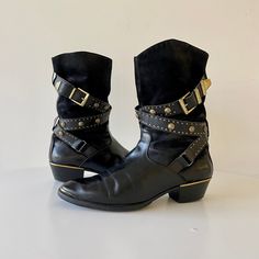 "Vintage Gianni Versace Western Boots In Leather & Suede With Medusa & Stud Detail, Wrap Belt & Gold Buckle Detail.  Pointed Toe With Gold Cap & Stack Heel With Gold Detail.  Estimated circa later 90's early 2000's Condition: Very Nice Vintage Condition - Missing A Few Medusa's & Some Minor Scuffing.  Right Shoe Is Missing Two Medusa's and Left Shoe Is Missing Two.  All Small Studs Are In Tacked.  Please See Pictures.  Appear To Have Been Resoled.  Interior Label In Tacked With Some Waring.  Int Belt Gold Buckle, Gold Cap, Belt Gold, Gold Caps, Wrap Belt, Suede Leather Boots, Western Leather, Gianni Versace, Western Style