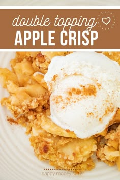 a white plate topped with an apple crumbled dessert and whipped cream on top