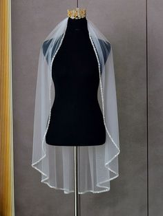 a mannequin with a veil on top of it