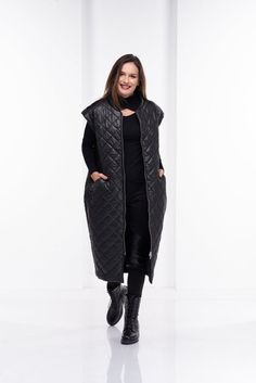 Super chic and extravagant this quilted long vest has minimalist silhouette, while the puffer fabric will keep you warm.Two side pockets and long double size zipper make this model a "must have" piece to your wardrobe.The model in the picture is 168cm. ⅼ 5.5 ft. tall and is wearing size S / color: Black🌟 INFO:• Worldwide EXPRESS shipping – please provide a phone number for shipping documents• US Sizing XS to 4XL – body size chart available below• We offer customization to Personal Measurements Quilted Sleeveless Outerwear For Fall, Quilted Sleeveless Fall Outerwear, Sleeveless Quilted Outerwear For Fall, Winter Workwear Puffer Vest, Long Coat For Women, Quilted Vests, Cyberpunk Jacket, Sleeveless Puffer Jacket, Shipping Documents