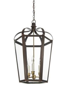 a hanging light fixture with two candles in it